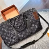Louis Vuitton Keepall Monogram Denim Travel Bag